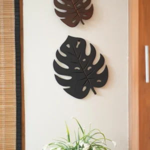 Set of two monstera leaves in wood in its natural brown shade for enhancing home decor style
